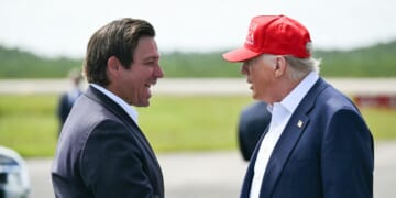 Florida Gov. Ron DeSantis shakes hands with President Donald Trump upon Trump's arrival at Dade-Collier Training and Transition Airport in Ochopee, Florida, on July 1, 2025.