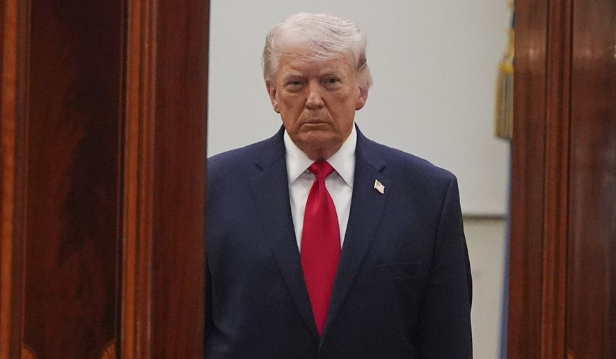 President Donald Trump arrives from the Blue Room to speak about the Iran war from the Cross Hall of the White House on Wednesday, April 1, 2026, in Washington. (AP Photo/Alex Brandon, Pool)
