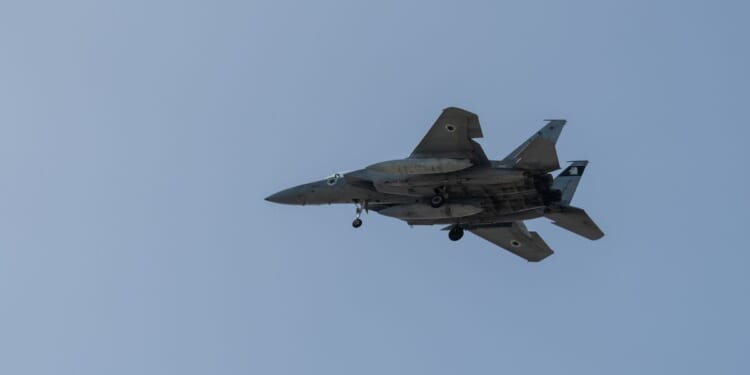 An F-15 fighter jet flies on March 20, 2026 in Rehovot, Israel.