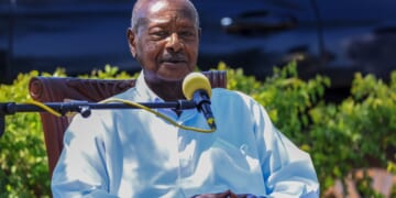 Yoweri Museveni speaking while seated
