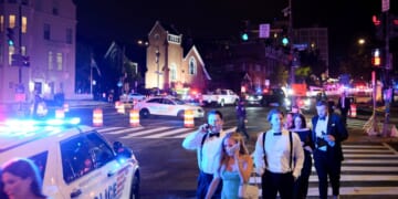 Guests walk away from the Washington Hilton amid a heavy police presence after shots were heard during the White House Correspondents' Dinner in Washington, D.C., on April 25, 2026.