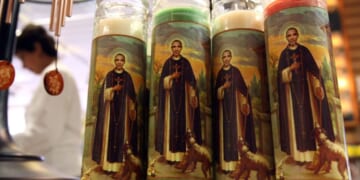 Candles depicting former President Barack Obama as a saint stand displayed at "Just For Fun" in San Francisco, California, on March 2, 2009.