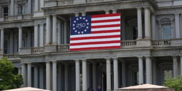 The Eisenhower Executive Office Building with a flag celebrating the United States' 250th anniversary is seen in Washington, D.C., on April 24, 2026.