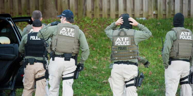 Authorities from the Bureau of Alcohol, Tobacco, Firearms, and Explosives prepare to search a home in Hyattsville, Maryland, on Nov. 8, 2011.