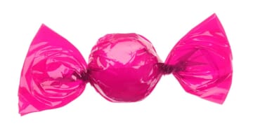 A candy wrapped in a pink wrapper.