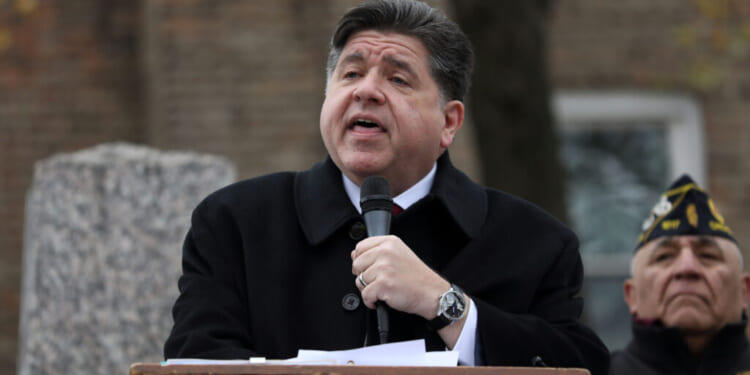 Illinois Gov. JB Pritzker delivers a short speech during a Veterans Day ceremony at Little Village's Manuel Perez Jr. Memorial Plaza on November 11, 2025 in Chicago, Illinois. After being criticized for a photo-op with other federal immigration agents in downtown Chicago on November 10th, Gregory Bonino, the top Border Patrol official leading the charge on the Trump administration's immigration crackdown in Chicago, invited the governor to Little Village. (Photo by Abel Uribe/Getty Images)