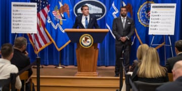 Acting Attorney General Todd Blanche stands and announces initiative against the SPLC alongside FBI Director Kash Patel on April 21, 2026.
