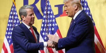 President Donald Trump and Ga. Gov. Brian Kemp shaking hands