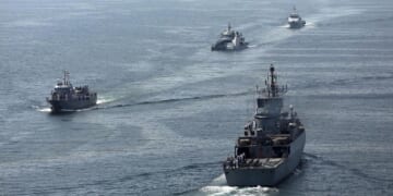 This handout photo made available by the Iranian Army Office on March 12, 2025, shows navy vessels taking part in a joint Iranian-Russian-Chinese military drill in the Gulf of Oman.