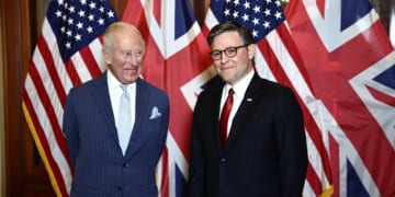 King Charles and Mike Johnson standing