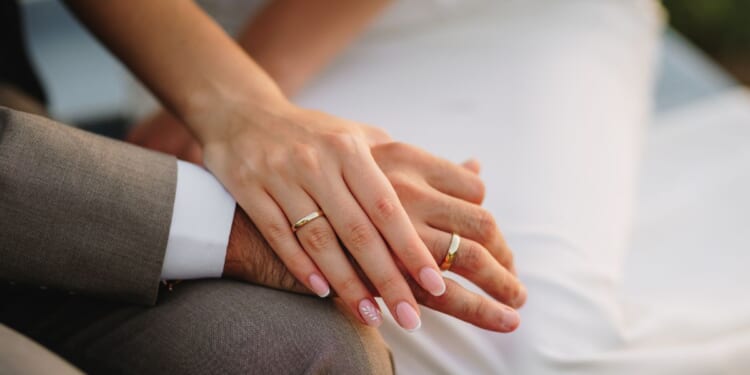 Newlywed hands close up.