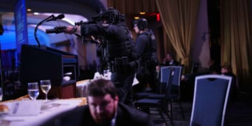 Agents stand guard after a shooting took place at the White House Correspondents' dinner at the Washington Hilton in Washington, DC on April 25, 2026.