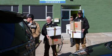 Federal agents remove documents from a childcare center in South Minneapolis.